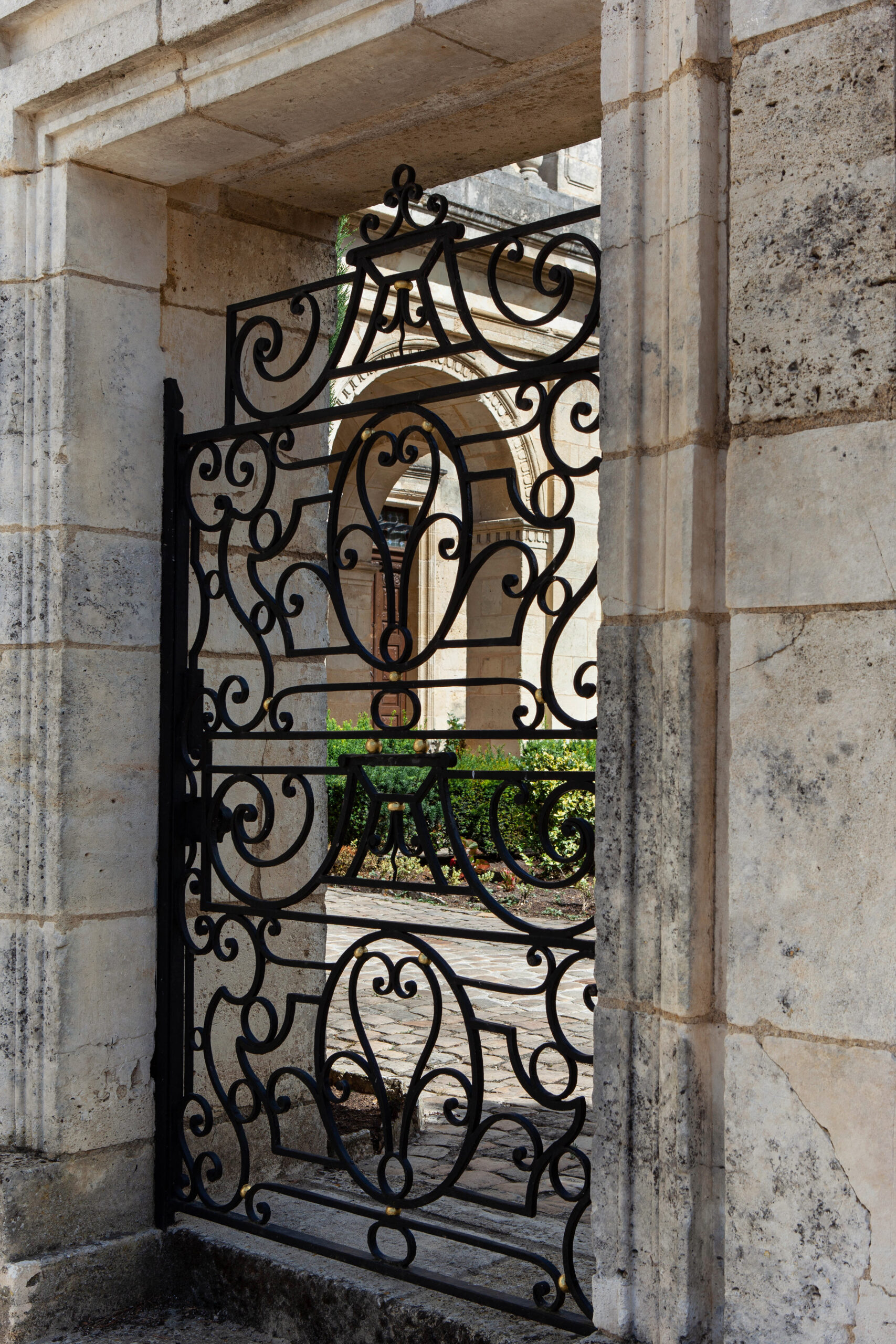 Wrought iron gate and small patio